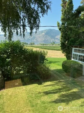 a view of swimming pool with a yard