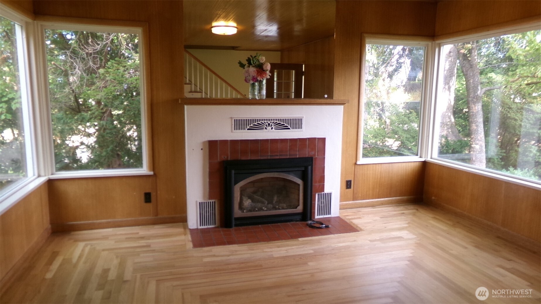 1555 Swartout Road Manson, WA 98831 - Photo 18 of 40 a view of an empty room with wooden floor and a window