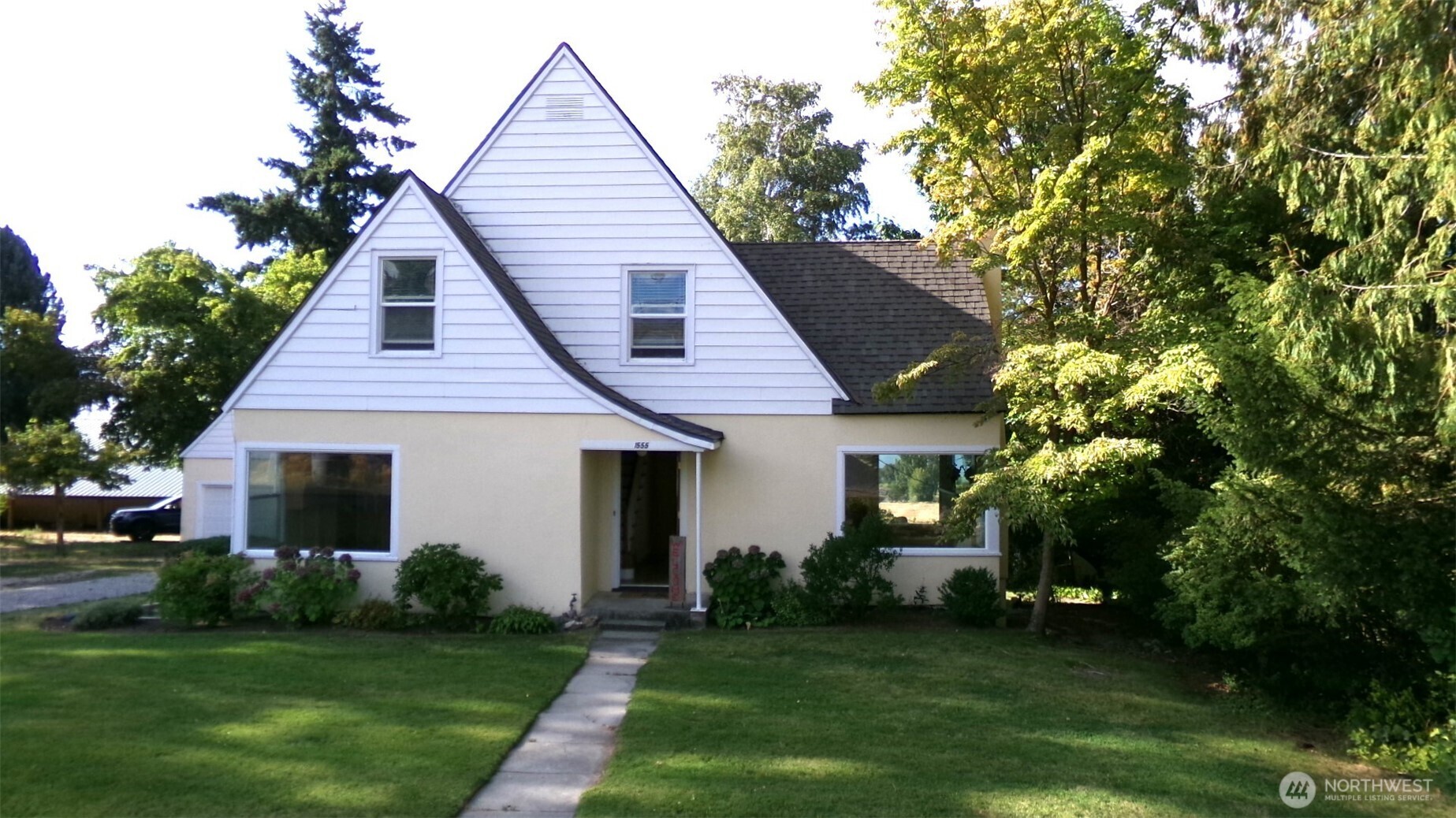 1555 Swartout Road Manson, WA 98831 - Photo 2 of 40 a front view of a house with a garden