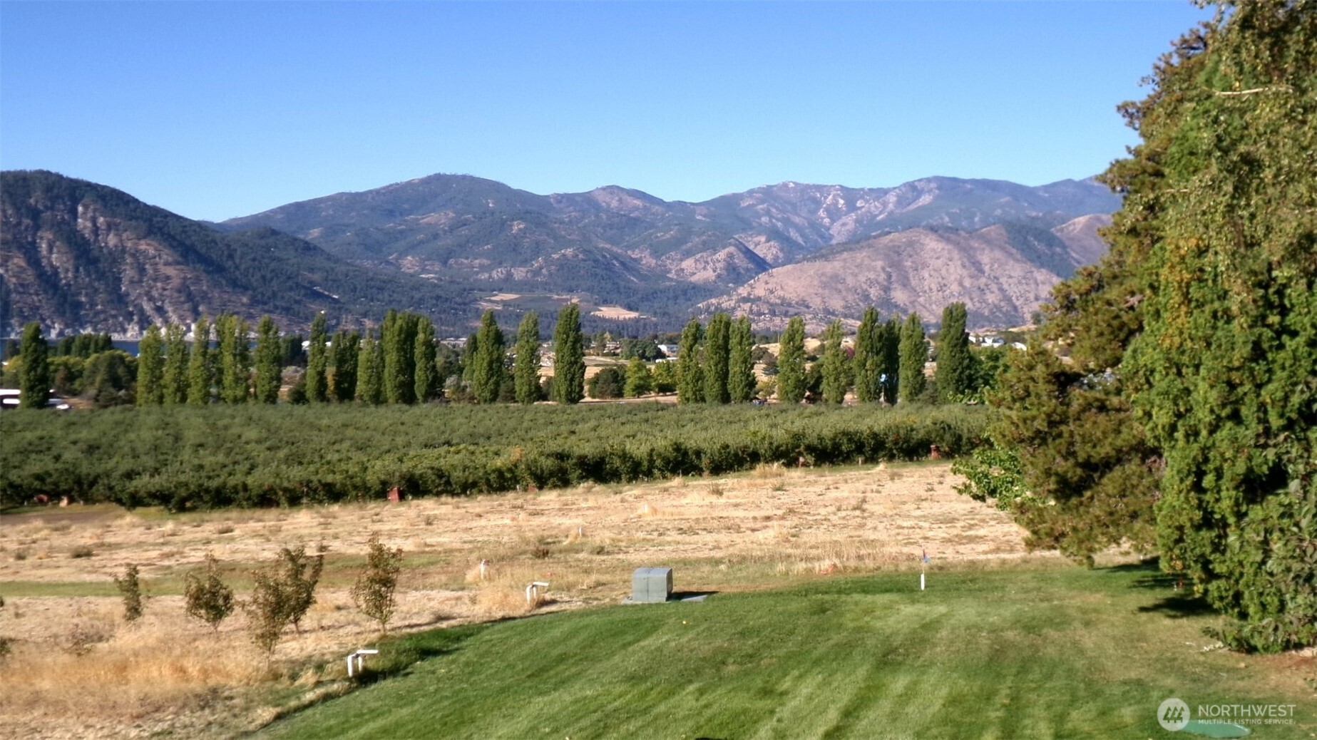 1555 Swartout Road Manson, WA 98831 - Photo 39 of 40 a view of a house with a yard