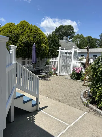 a kitchen with kitchen island granite countertop a stove a sink and a refrigerator