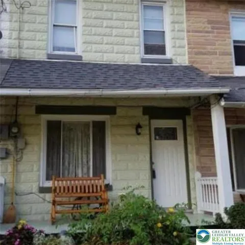 a view of a house with a back yard