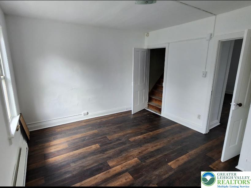 502 Atlas Road Northampton, PA 18067 - Photo 3 of 11 a view of an empty room with wooden floor and a window