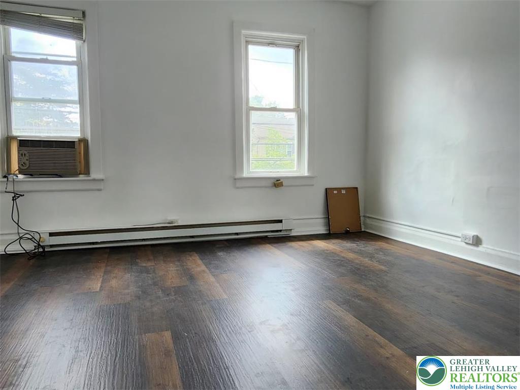 502 Atlas Road Northampton, PA 18067 - Photo 4 of 11 an empty room with wooden floor and windows