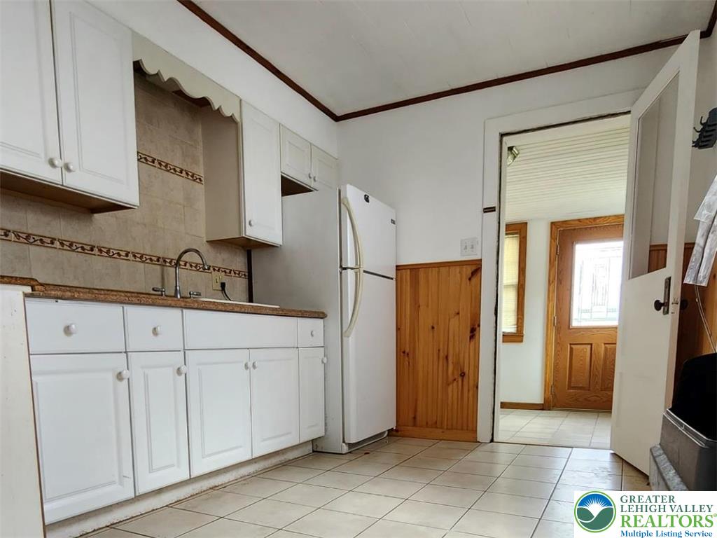 502 Atlas Road Northampton, PA 18067 - Photo 7 of 11 a kitchen with white cabinets and refrigerator