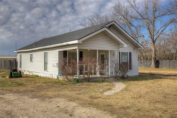 a house with yard in front of it