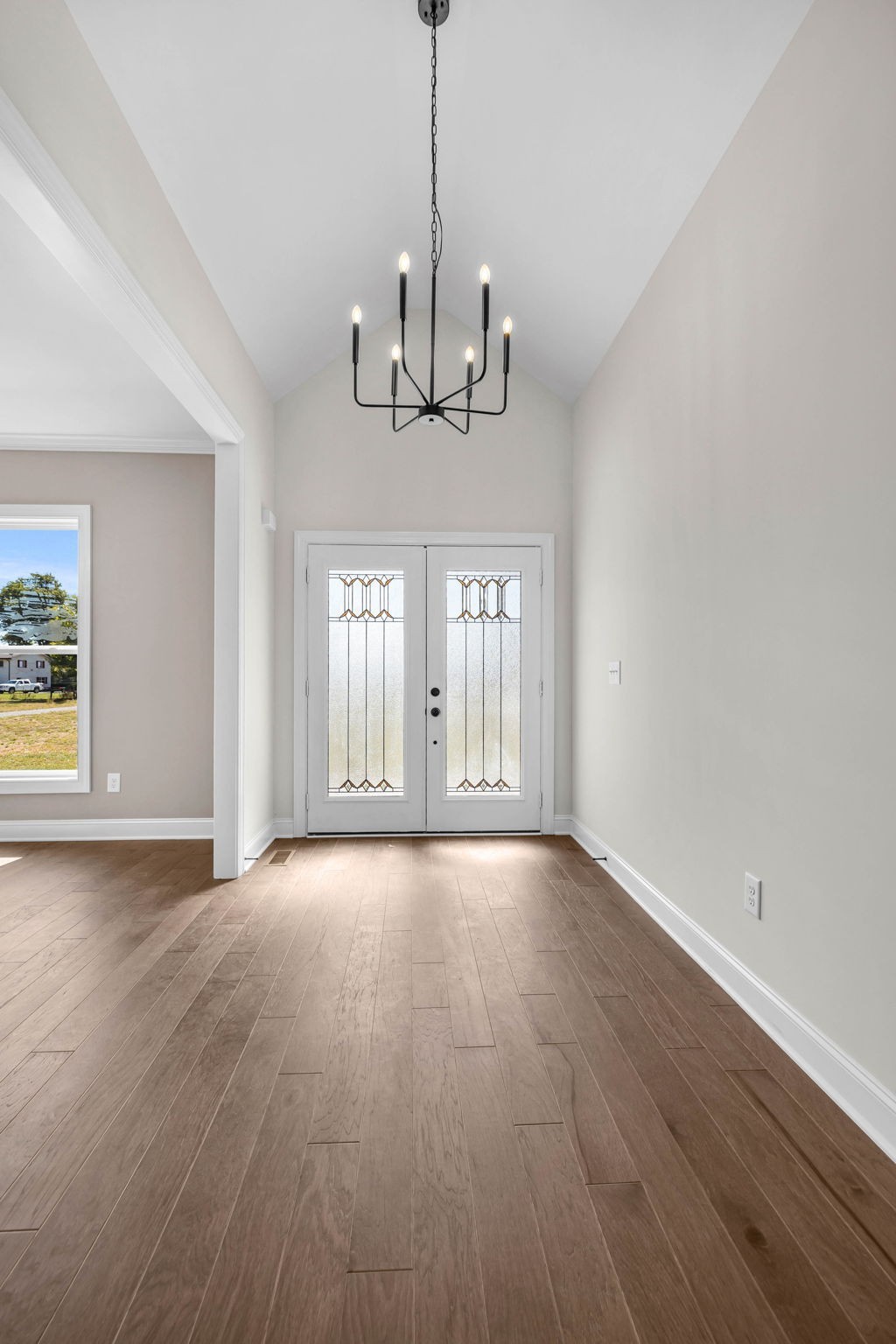 8708 Newtown Road Rockvale, TN 37153 - Photo 6 of 50 a view of an empty room with wooden floor and fan