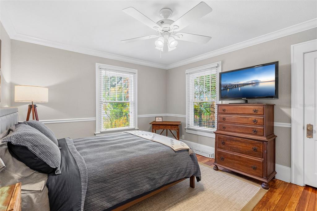 1003 East Jackson Street Orlando, FL 32801 - Photo 14 of 27 a bedroom with a bed and a flat screen tv