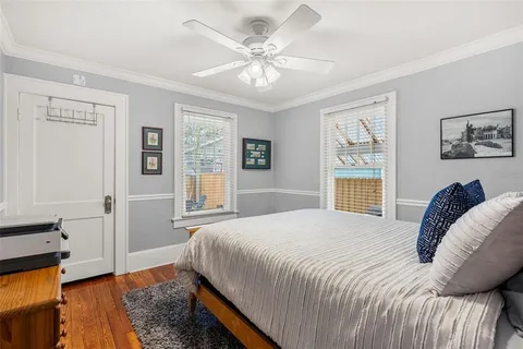 a bedroom with a large bed and a window