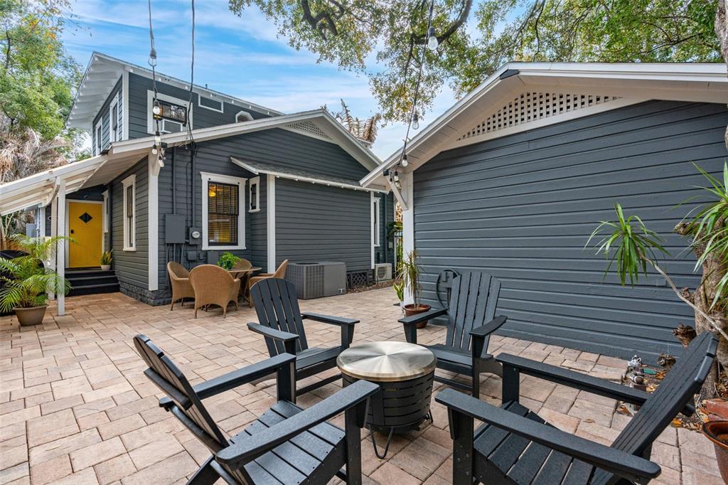 1003 East Jackson Street Orlando, FL 32801 - Photo 18 of 27 a view of a patio with table and chairs and wooden fence