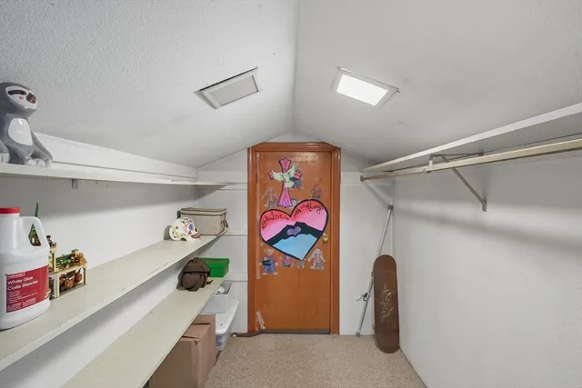 a bathroom with a granite countertop sink mirror and toilet