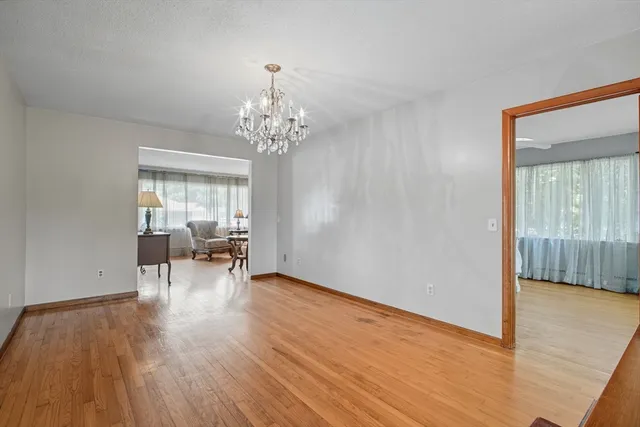 a view of dining room with furniture and wooden floor