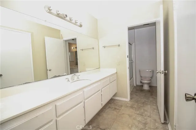 a bathroom with a shower and mirror