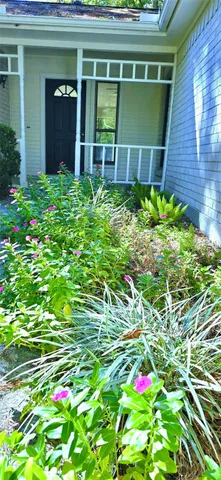 a house view with a backyard space
