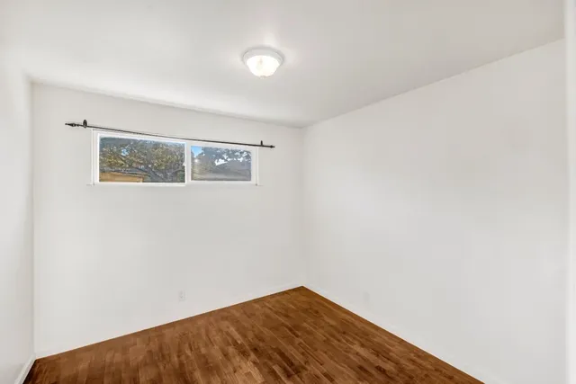 a view of a house with a flower garden