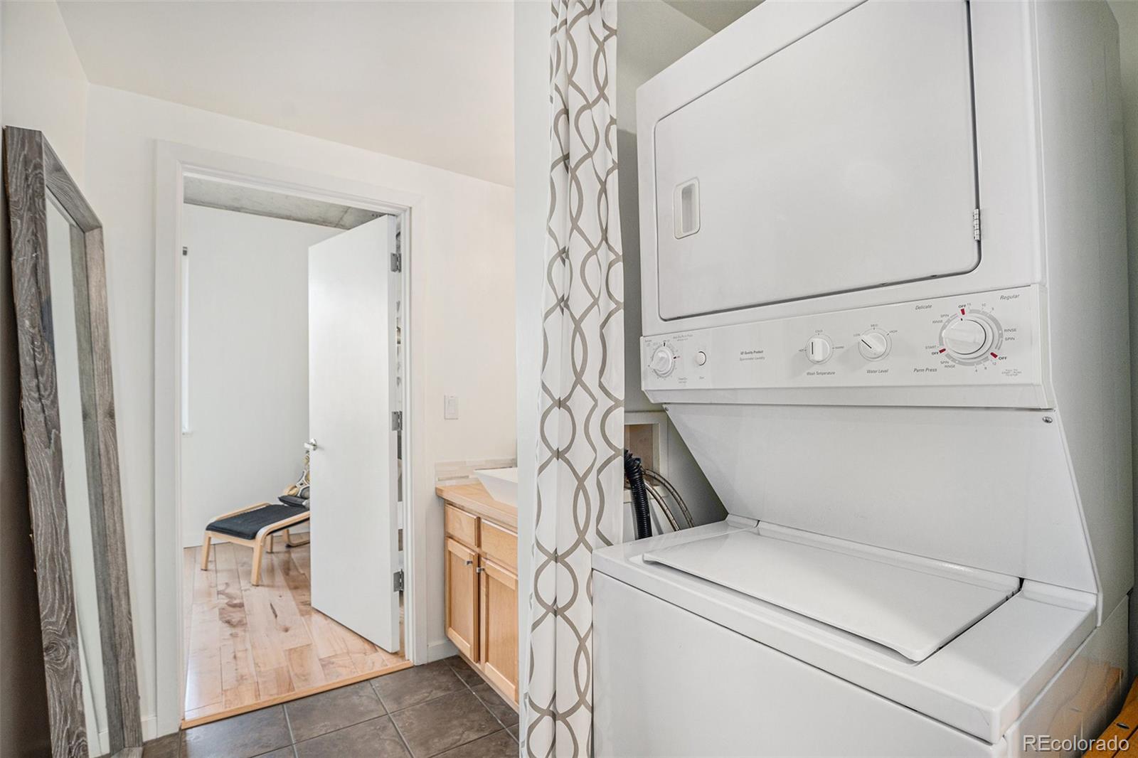 1475 Delgany Street, Unit 304 Denver, CO 80202 - Photo 19 of 28 a utility room with dryer and washer