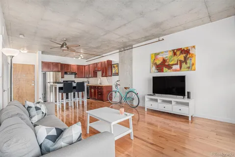 a view of a livingroom with furniture and a flat screen tv