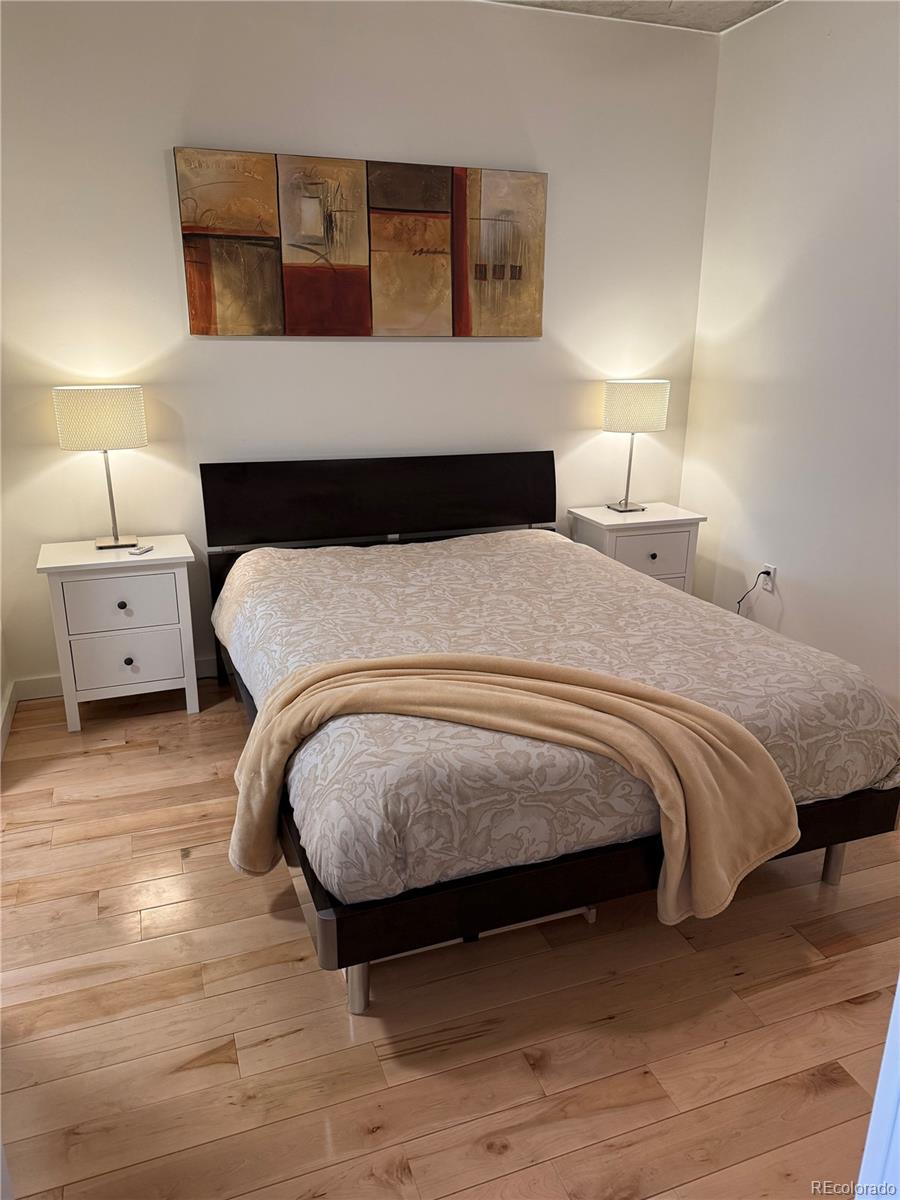 1475 Delgany Street, Unit 304 Denver, CO 80202 - Photo 10 of 28 a bedroom with a bed and window