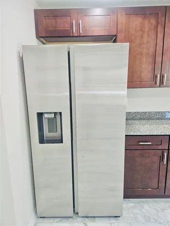 a close view of a refrigerator in kitchen