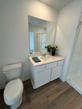 a view of a vase with a potted plant sitting on a table