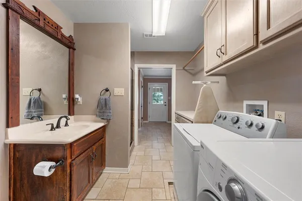 a bathroom with a sink and mirror