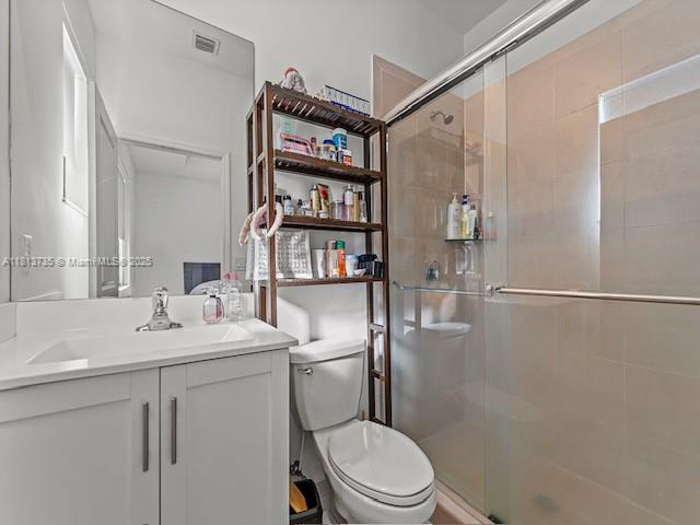 18058 Southwest 147th Court Miami, FL 33187 - Photo 16 of 27 a bathroom with a sink toilet and shower