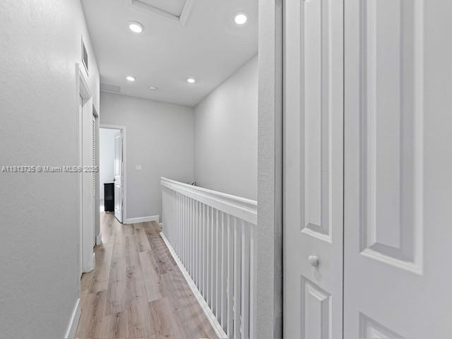 18058 Southwest 147th Court Miami, FL 33187 - Photo 17 of 27 a view of a hallway with wooden floor
