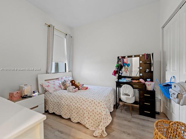 18058 Southwest 147th Court Miami, FL 33187 - Photo 20 of 27 a bedroom with bed and wooden floor