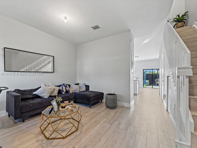 18058 Southwest 147th Court Miami, FL 33187 - Photo 2 of 27 a living room with furniture and a couch
