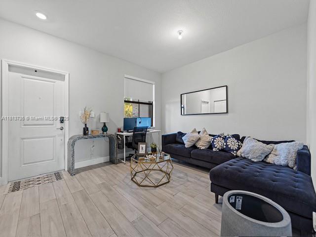 18058 Southwest 147th Court Miami, FL 33187 - Photo 4 of 27 a living room with furniture and a wooden floor