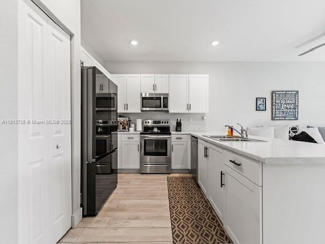 18058 Southwest 147th Court Miami, FL 33187 - Photo 5 of 27 a kitchen with stainless steel appliances a refrigerator stove and sink