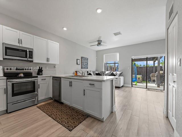 18058 Southwest 147th Court Miami, FL 33187 - Photo 6 of 27 a kitchen with a sink cabinets and stainless steel appliances