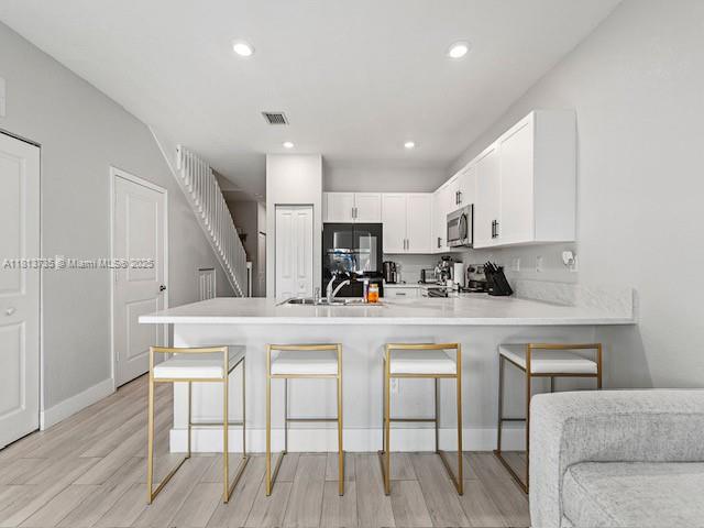 18058 Southwest 147th Court Miami, FL 33187 - Photo 7 of 27 a view of kitchen with cabinets and wooden floor