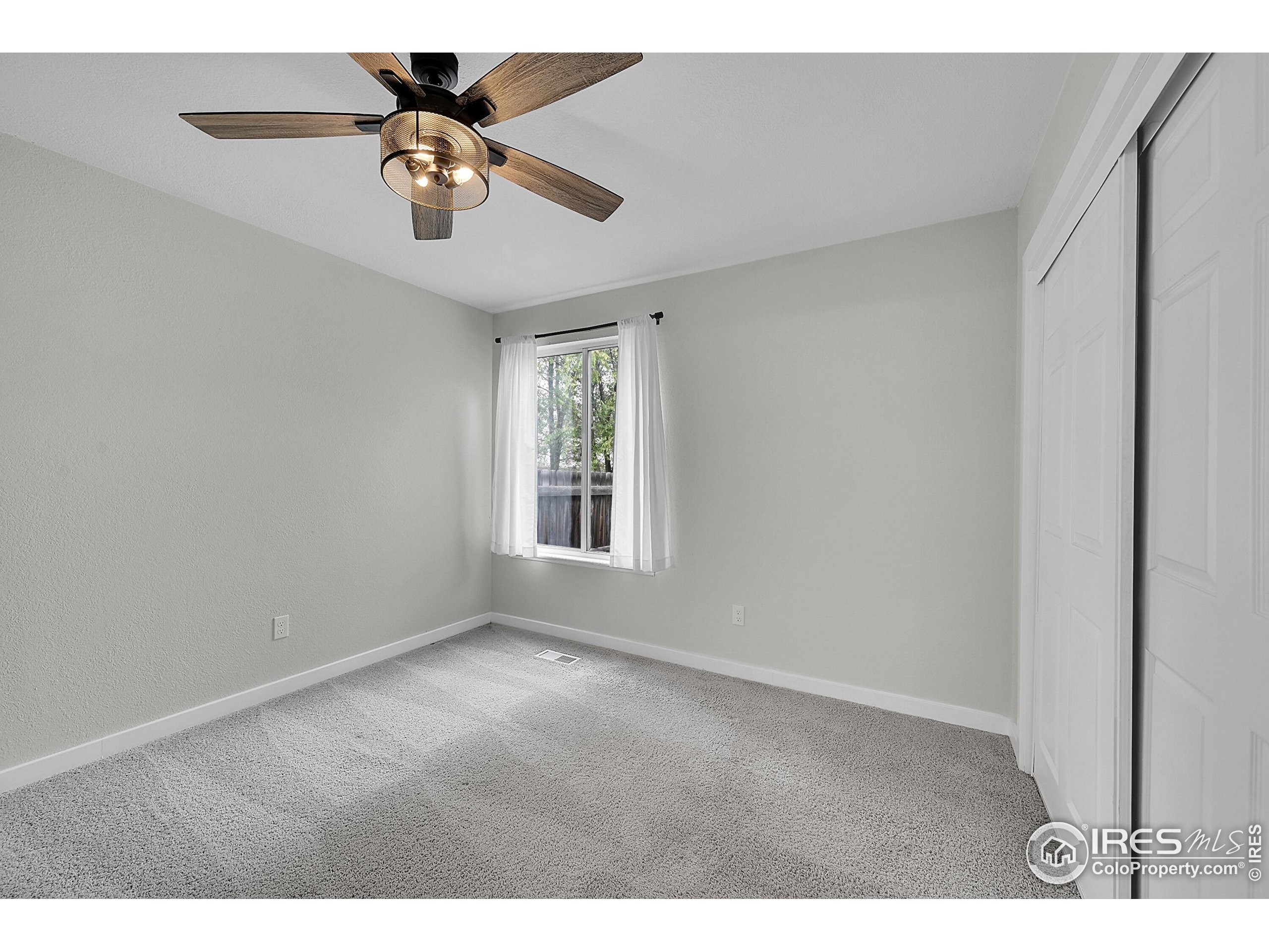 1836 Rice Street Longmont, CO 80501 - Photo 15 of 46 a view of an empty room with a window