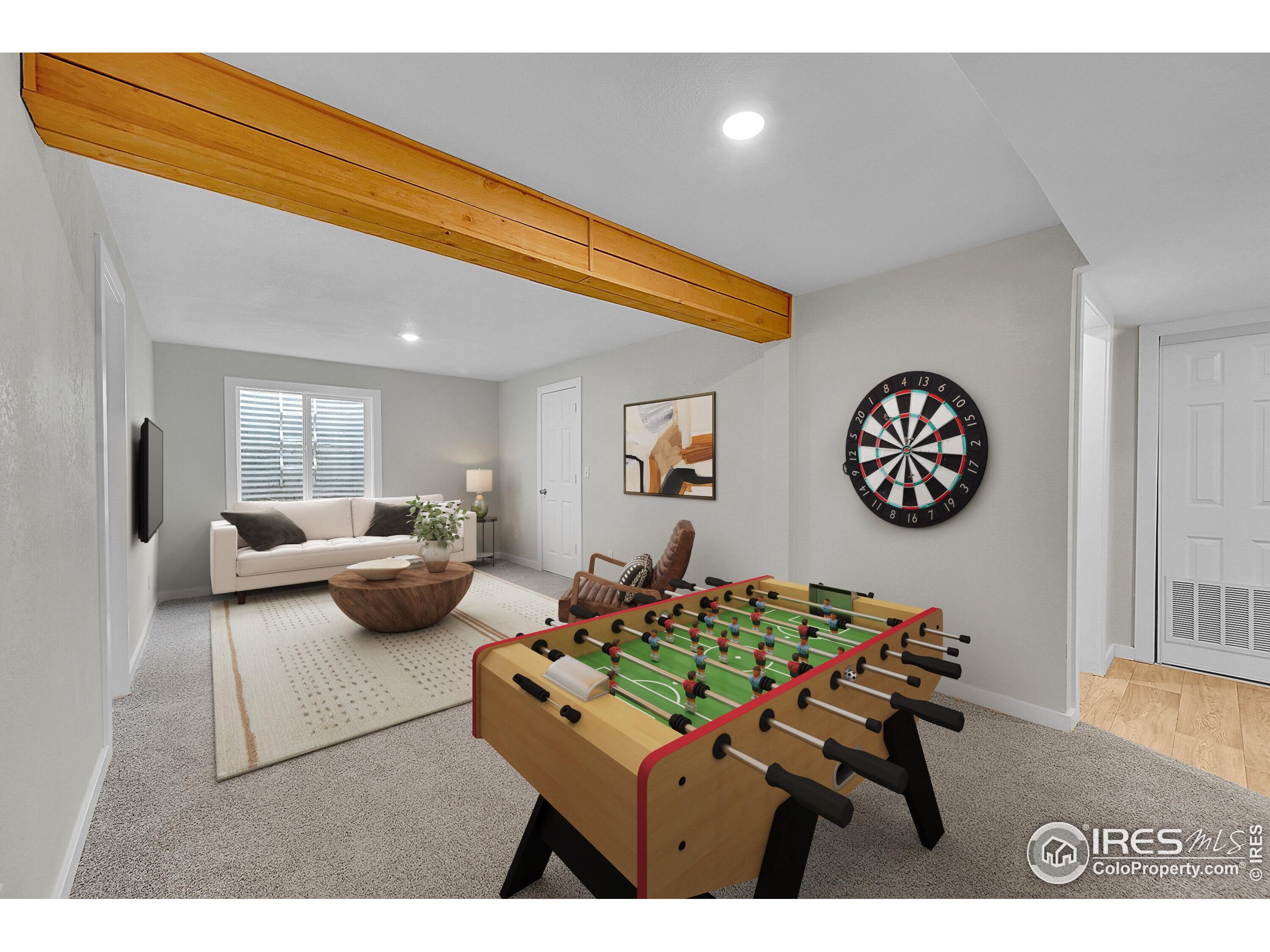 1836 Rice Street Longmont, CO 80501 - Photo 25 of 46 a living room with couches and a table with potted plant
