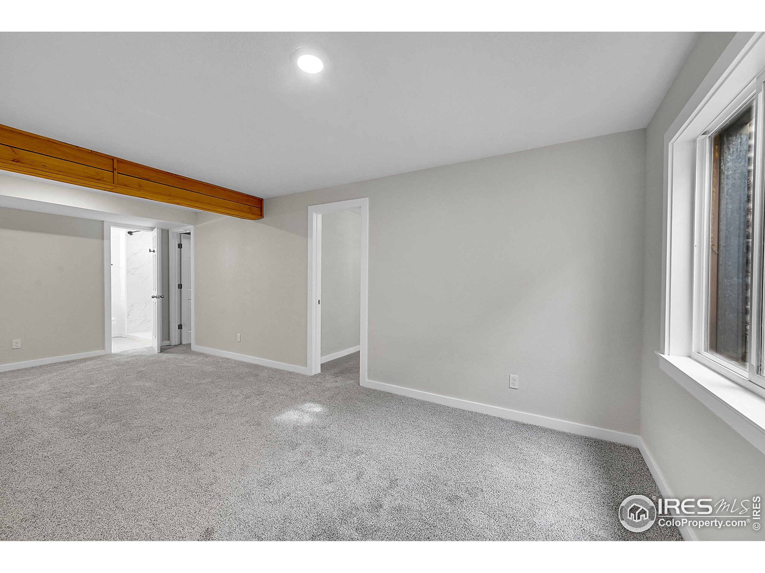 1836 Rice Street Longmont, CO 80501 - Photo 27 of 46 a view of an empty room and a window