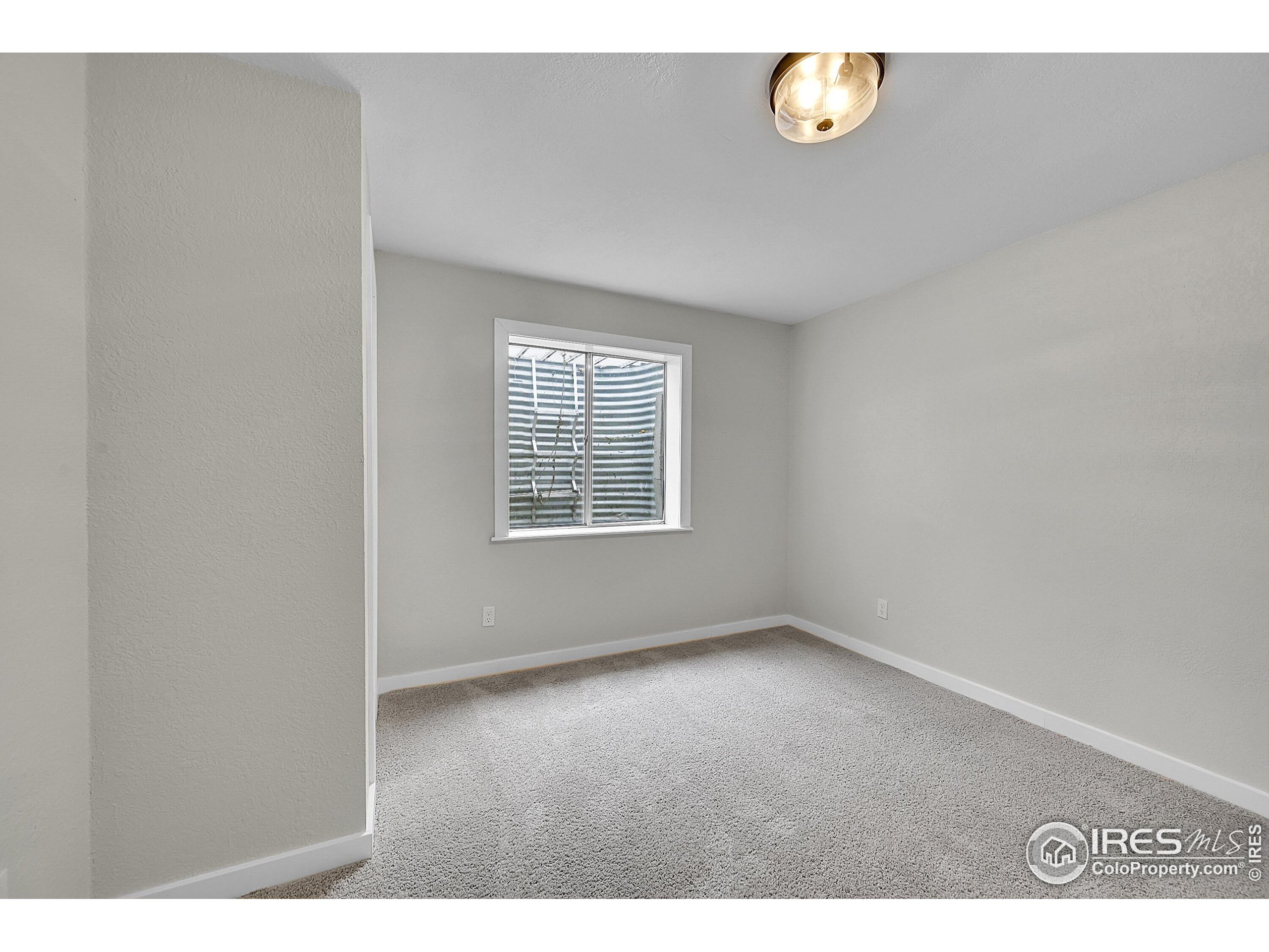 1836 Rice Street Longmont, CO 80501 - Photo 29 of 46 an empty room with windows
