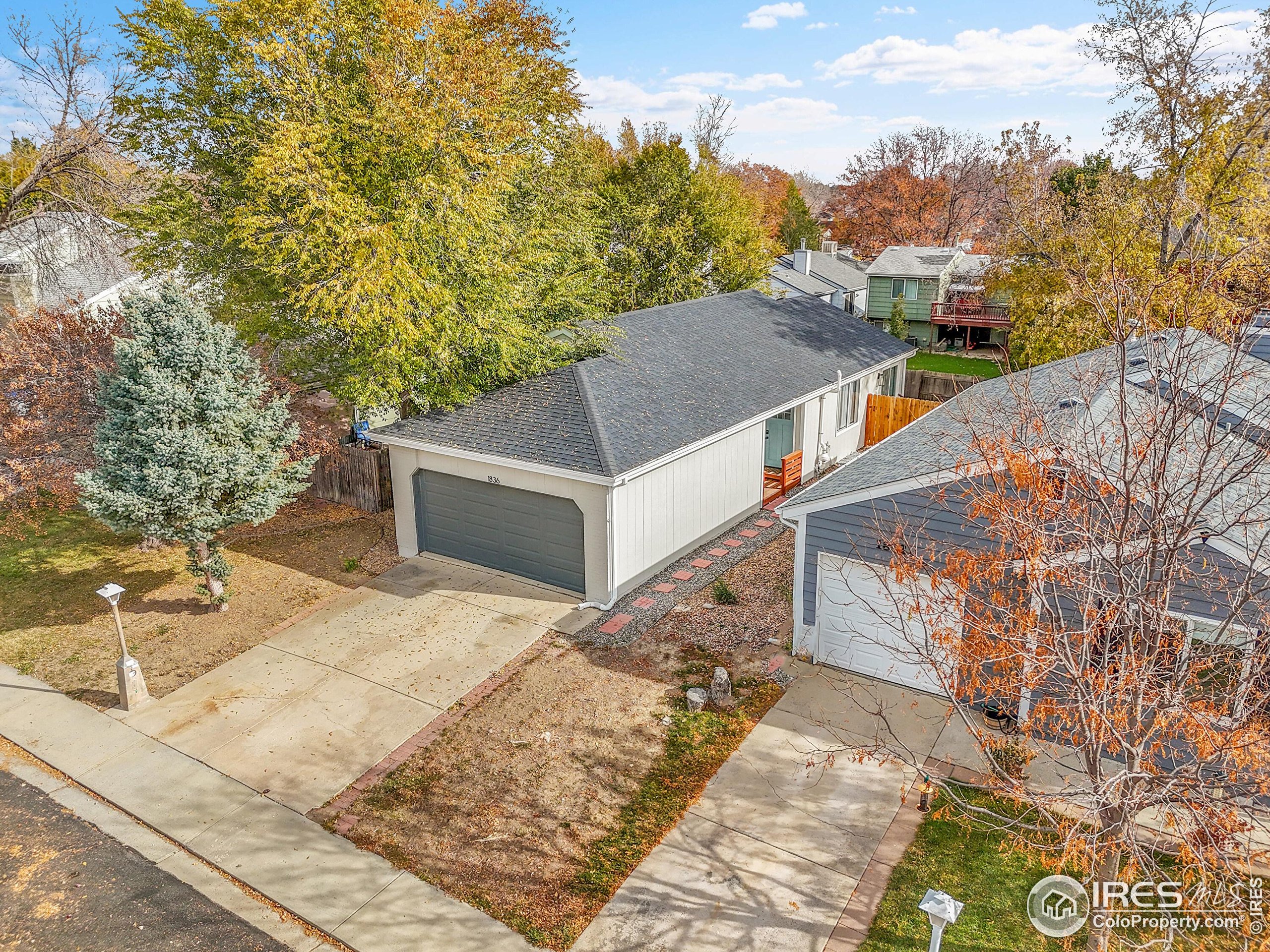 1836 Rice Street Longmont, CO 80501 - Photo 34 of 46 a balcony with a bench and trees