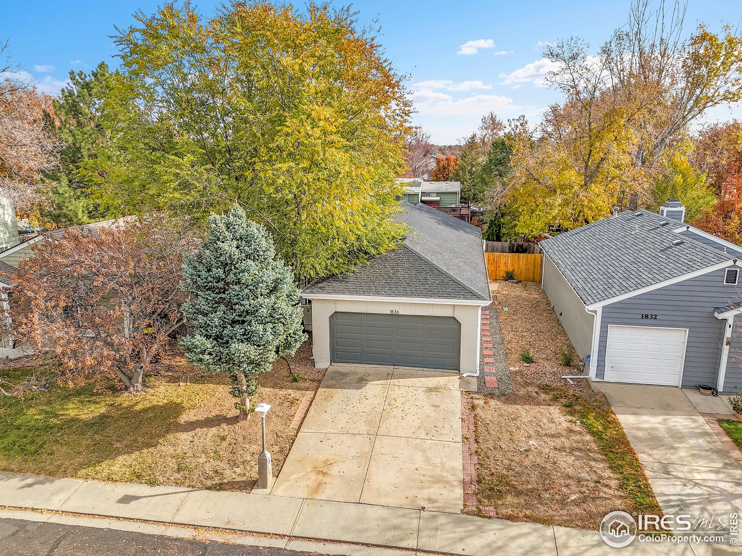 1836 Rice Street Longmont, CO 80501 - Photo 36 of 46 a front view of a house with trees