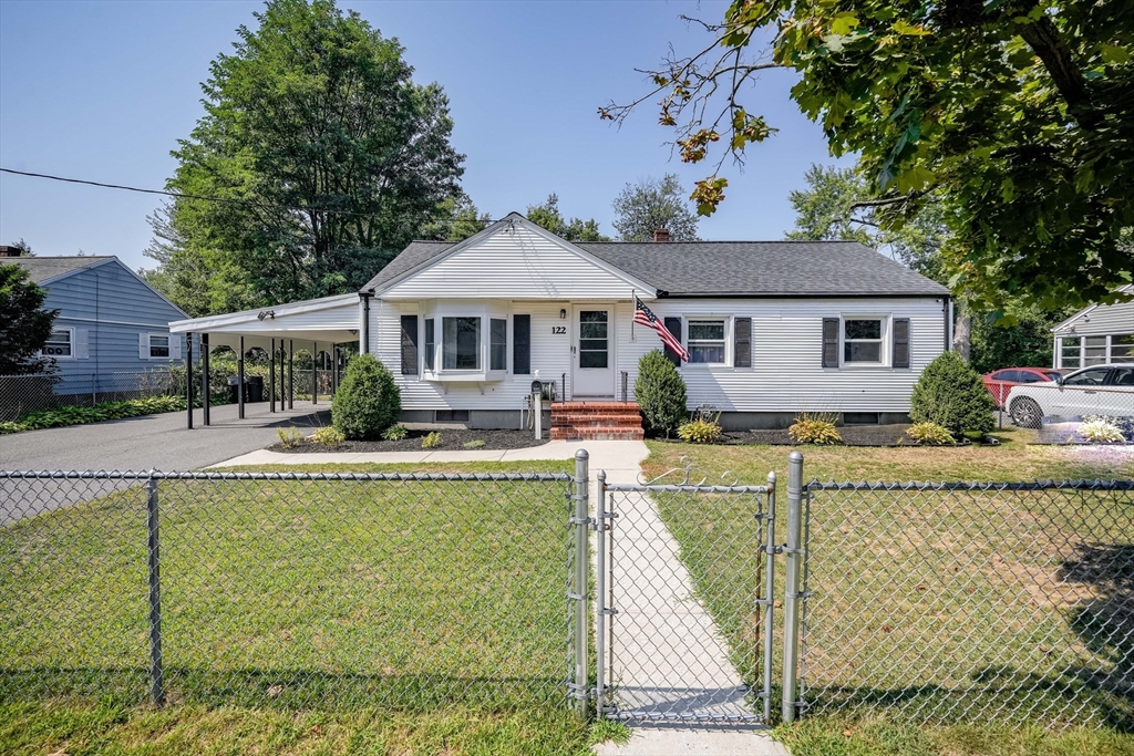 122 Drexel Street Springfield, MA 01104 - Photo 2 of 34 a front view of a house with swimming pool having outdoor seating