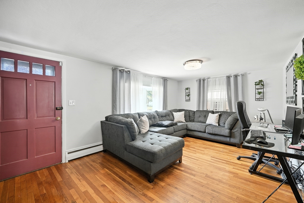 122 Drexel Street Springfield, MA 01104 - Photo 23 of 34 a living room with furniture and wooden floor