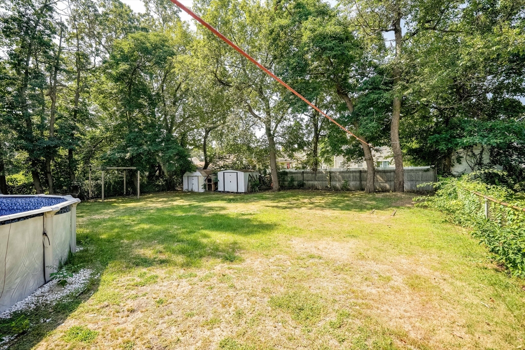 122 Drexel Street Springfield, MA 01104 - Photo 32 of 34 a swimming pool with trees in the background