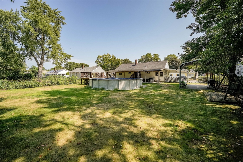 122 Drexel Street Springfield, MA 01104 - Photo 34 of 34 a backyard of a house with table and chairs