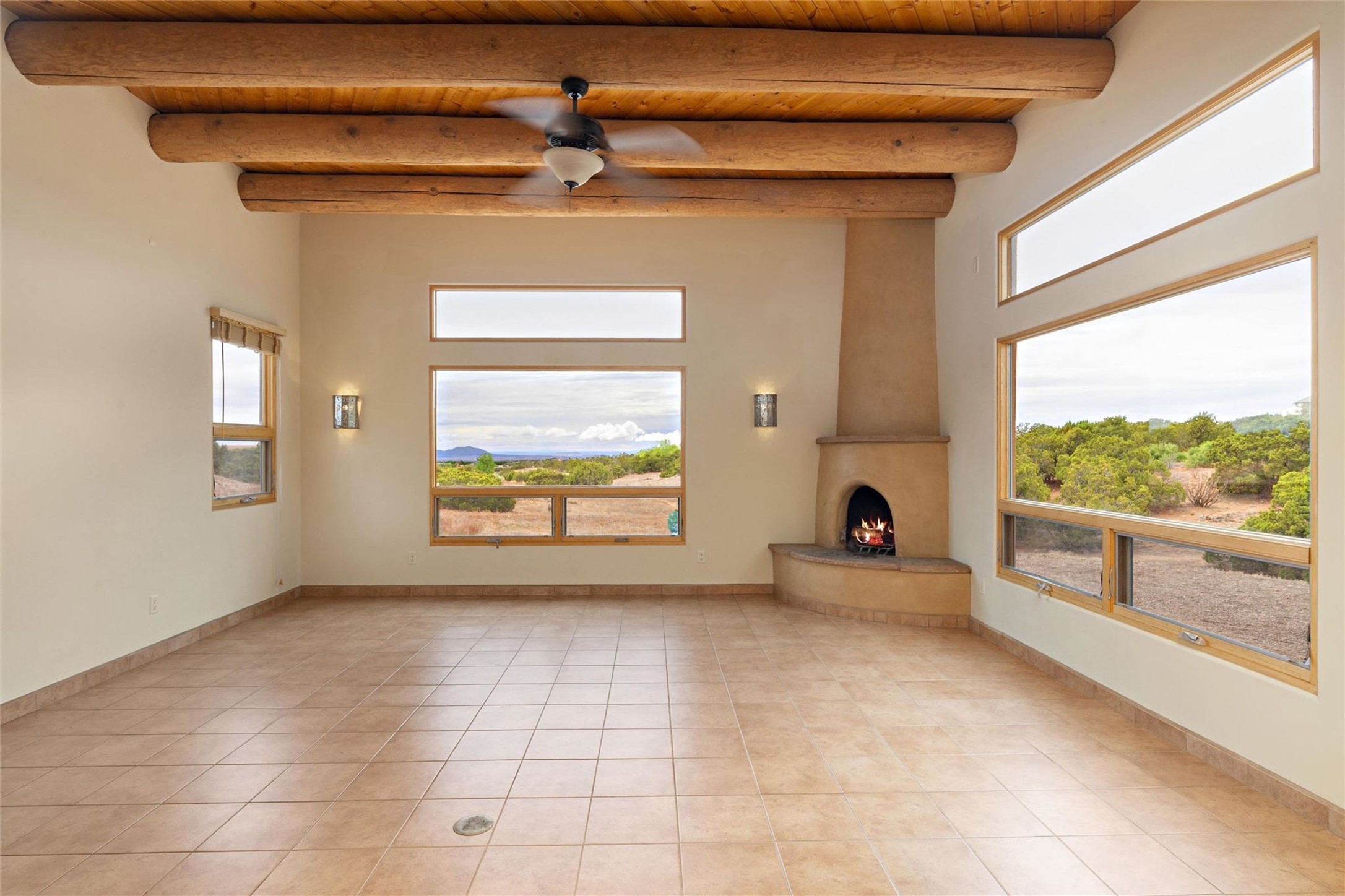 5 Rico Court Santa Fe, NM 87508 - Photo 3 of 32 Living room with kiva fireplace