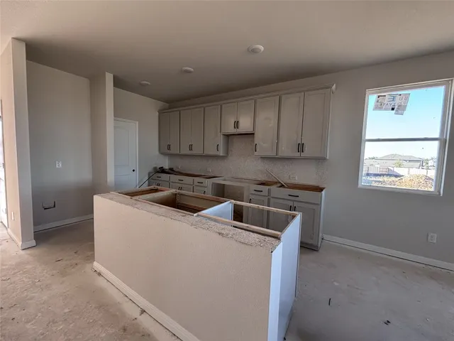 a room with furniture and a wooden floor