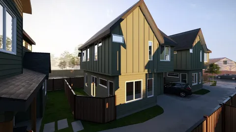 a view of a house with a yard and pathway