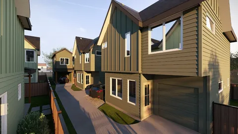 a view of a brick house with many windows