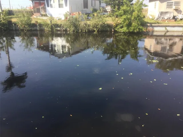 a water view of water with a building in the background