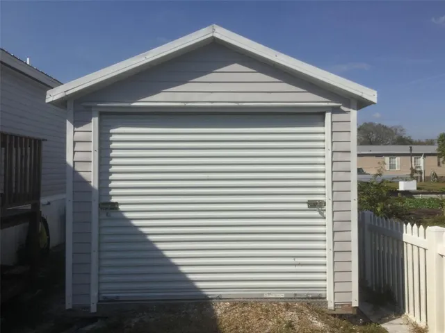 a front view of a house with wooden stairs