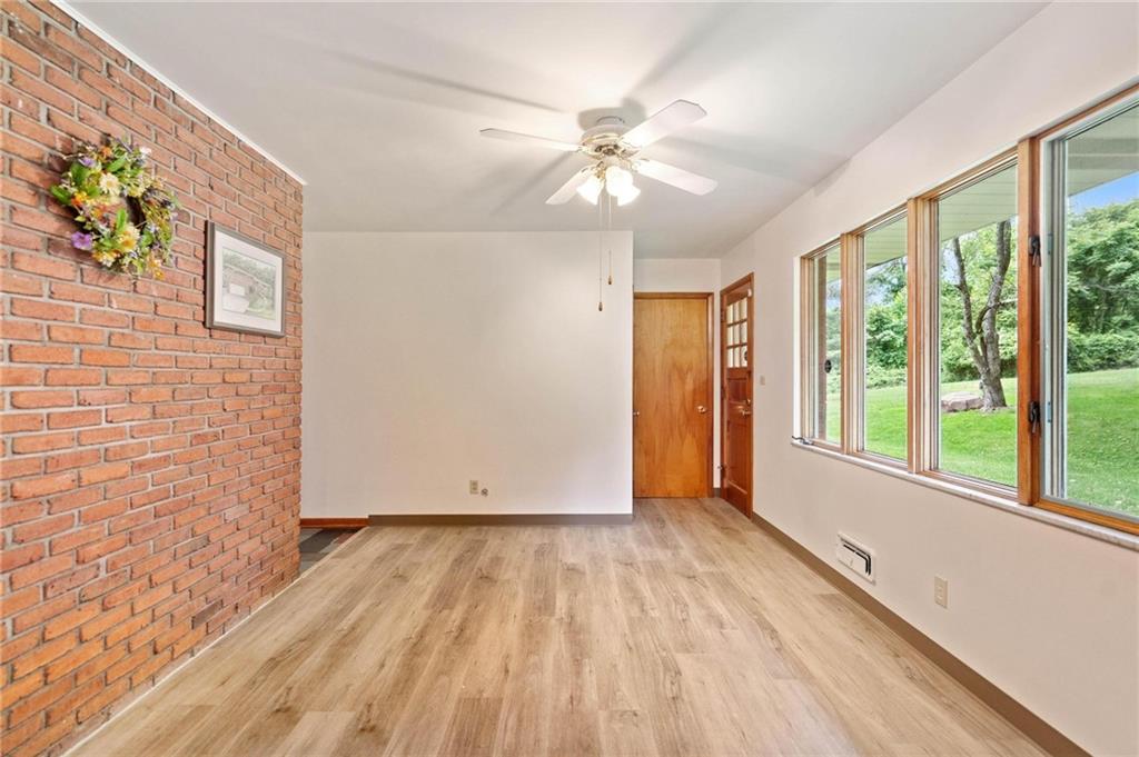 51 Lover Jonestown Road Charleroi, PA 15022 - Photo 11 of 24 a view of an empty room with a window and wooden floor